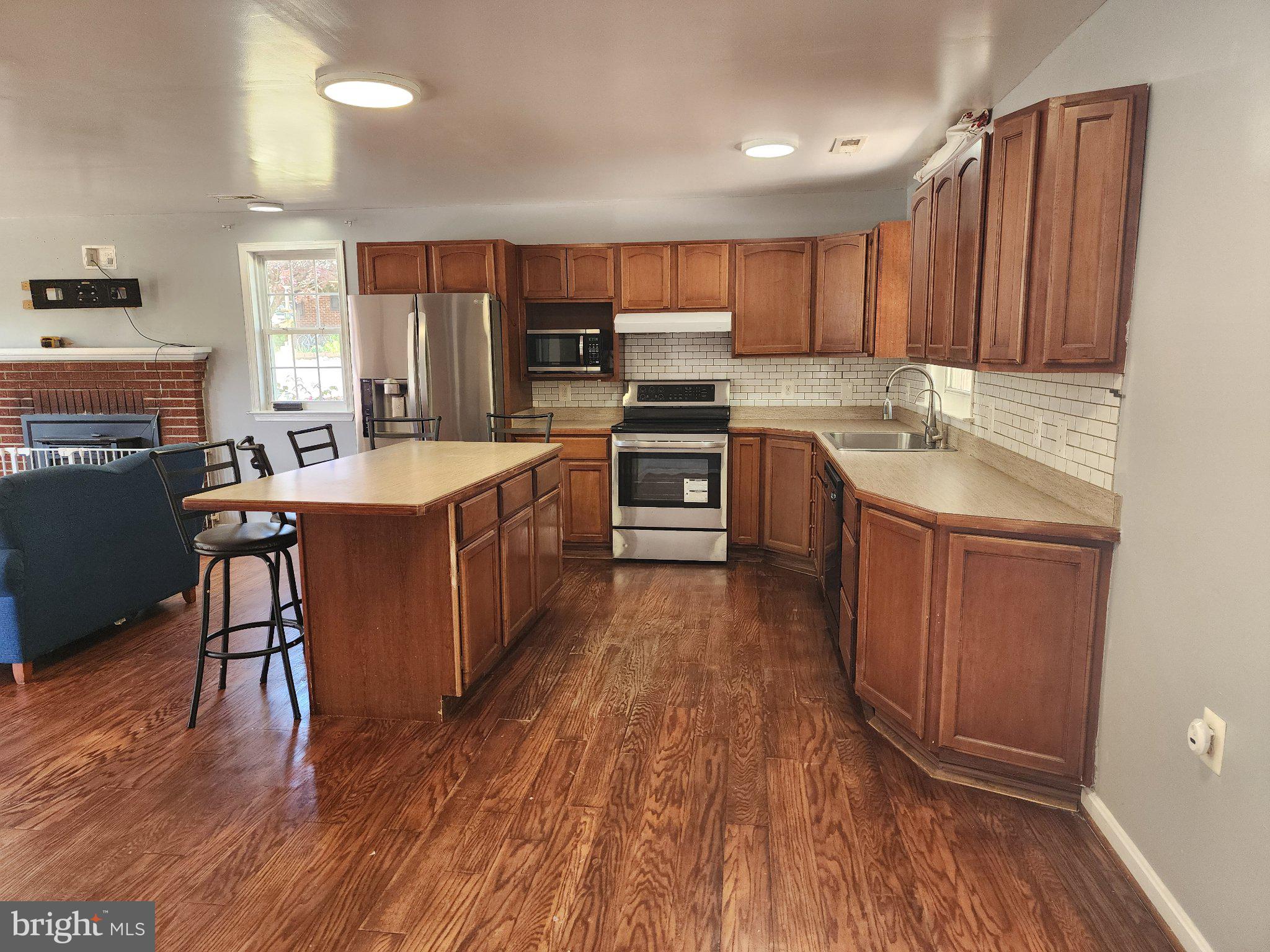 13 Main Street Huntingtown, MD 20639 - Photo 5 of 32 Modern kitchen with warm wood tones.