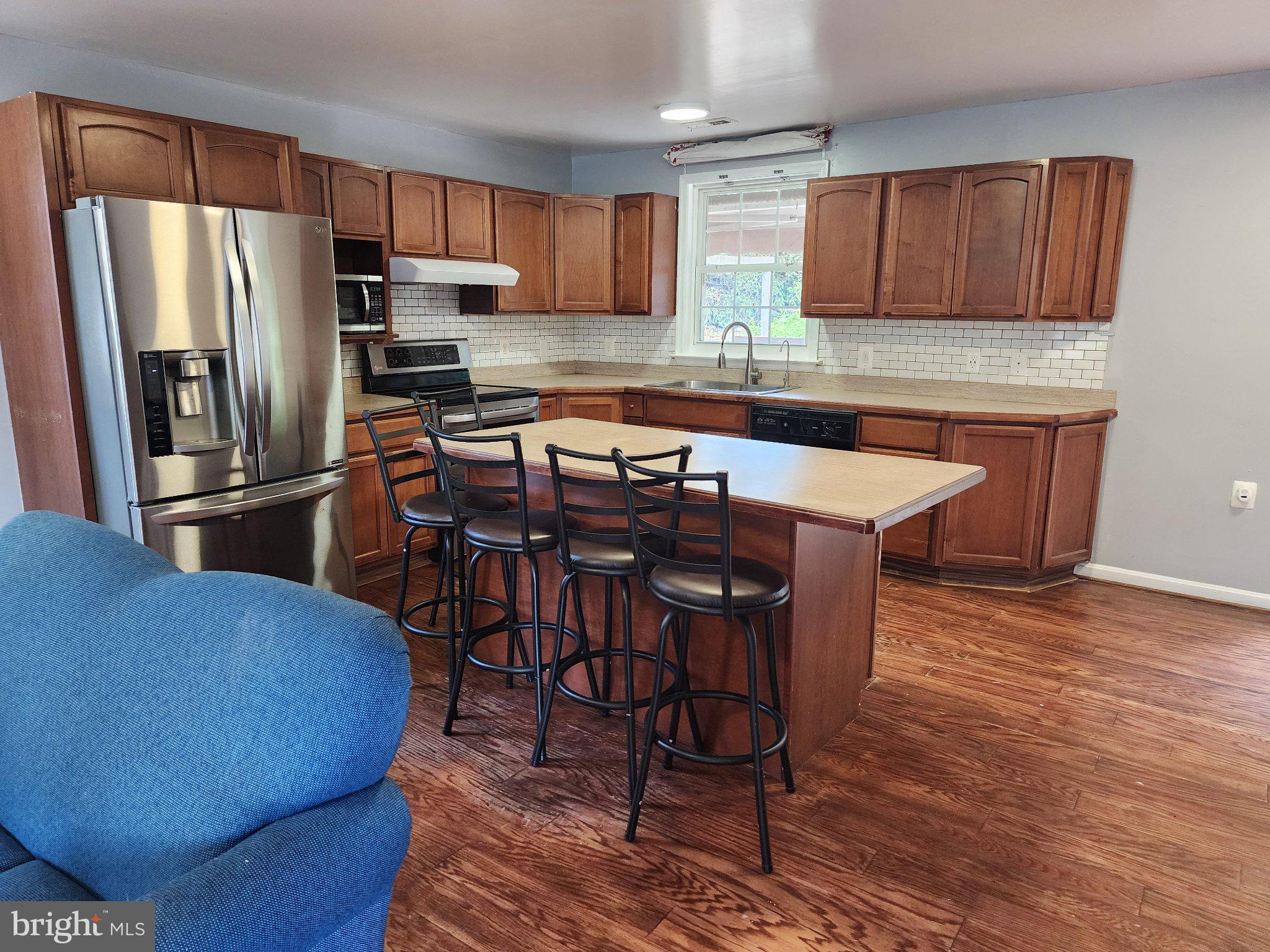 13 Main Street Huntingtown, MD 20639 - Photo 6 of 32 Modern kitchen with warm wood tones.