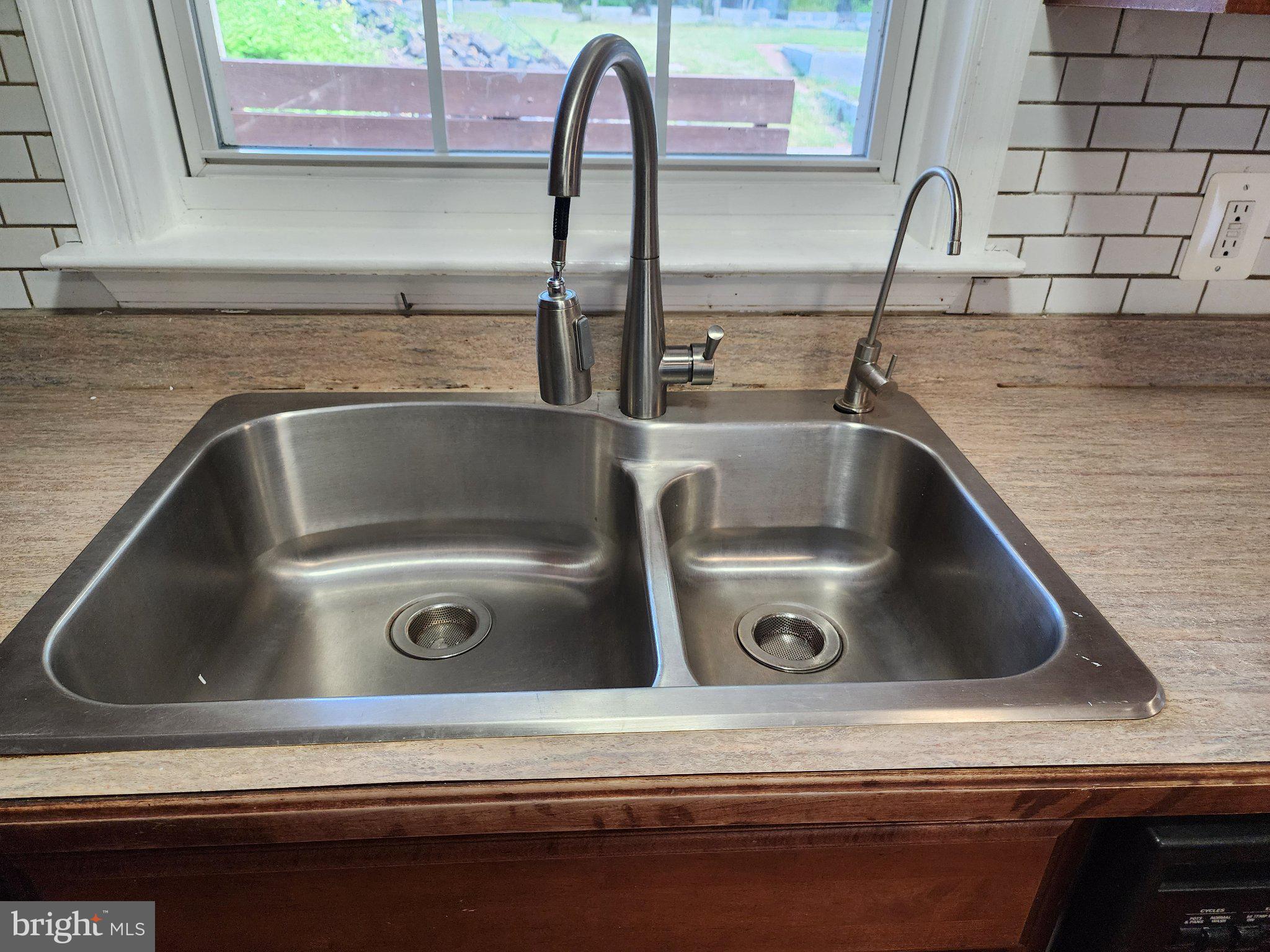 13 Main Street Huntingtown, MD 20639 - Photo 8 of 32 Sleek stainless steel sink design.