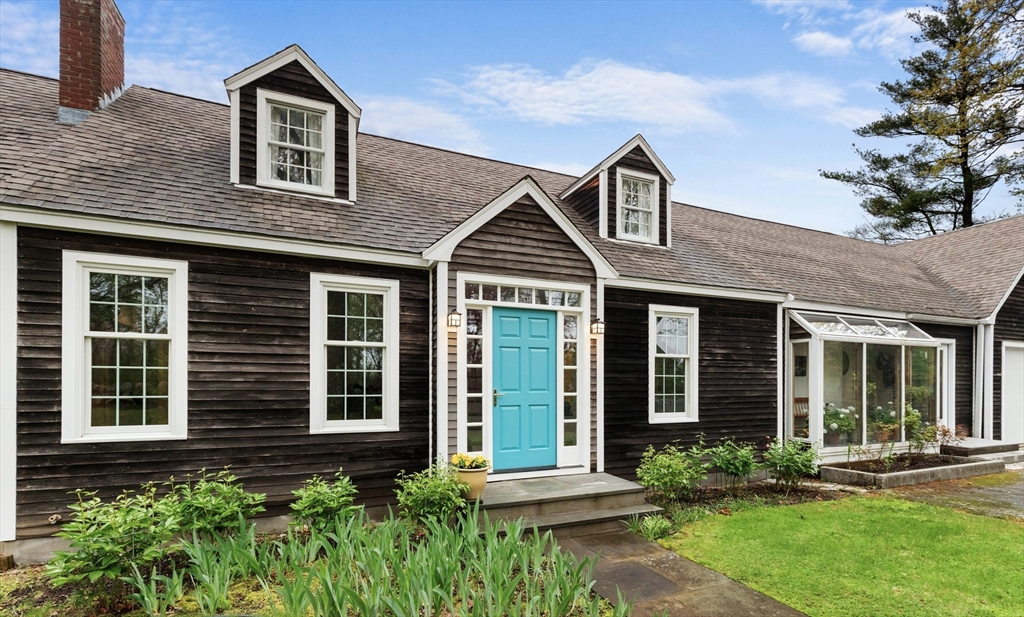 128 Argilla Road Ipswich, MA 01938 - Photo 2 of 25 a front view of a house with a yard