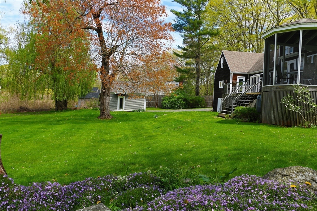128 Argilla Road Ipswich, MA 01938 - Photo 6 of 25 a view of a house with backyard and a tree