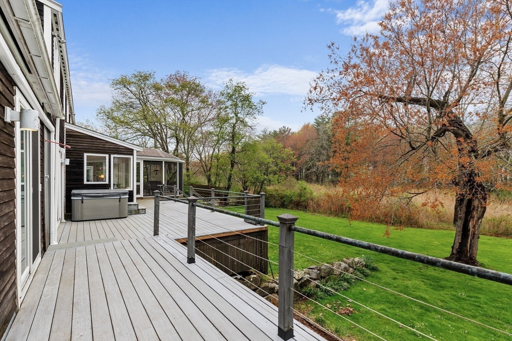 128 Argilla Road Ipswich, MA 01938 - Photo 8 of 25 a view of a balcony with mountain view and wooden floor