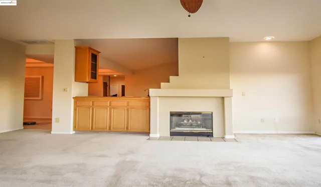 a view of a livingroom with a fireplace and a fireplace
