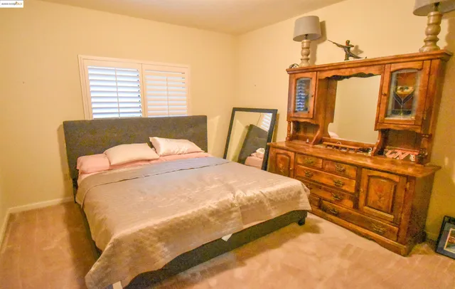 a view of a bedroom with bathroom