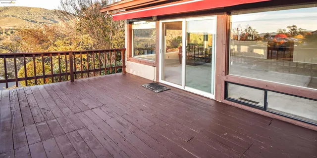 a view of balcony with wooden floor