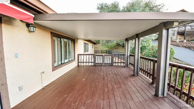 a view of hallway with wooden floor
