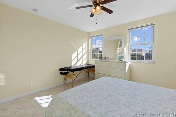 a bedroom with furniture and a window