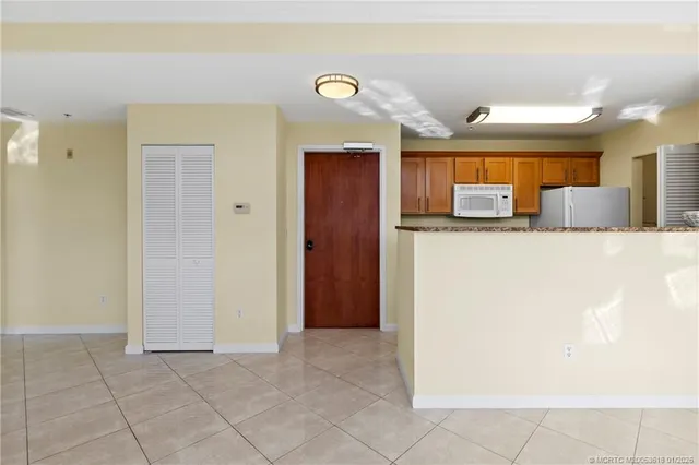 a view of hall way with furniture