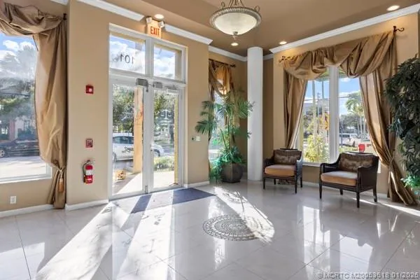 a living room with furniture and a large window