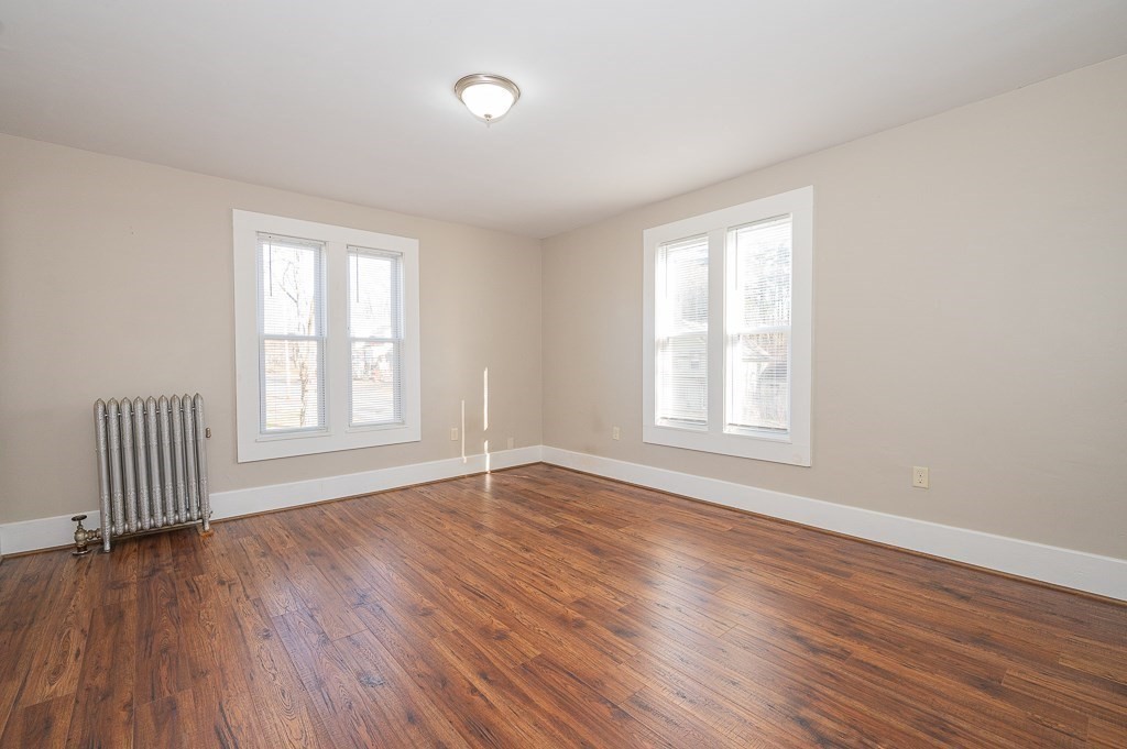 7 Ramsdell Street Warren, MA 01083 - Photo 13 of 34 an empty room with wooden floor and windows