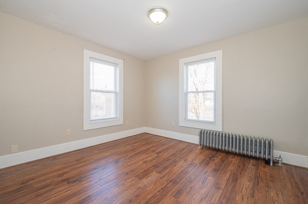 7 Ramsdell Street Warren, MA 01083 - Photo 15 of 34 an empty room with wooden floor and windows