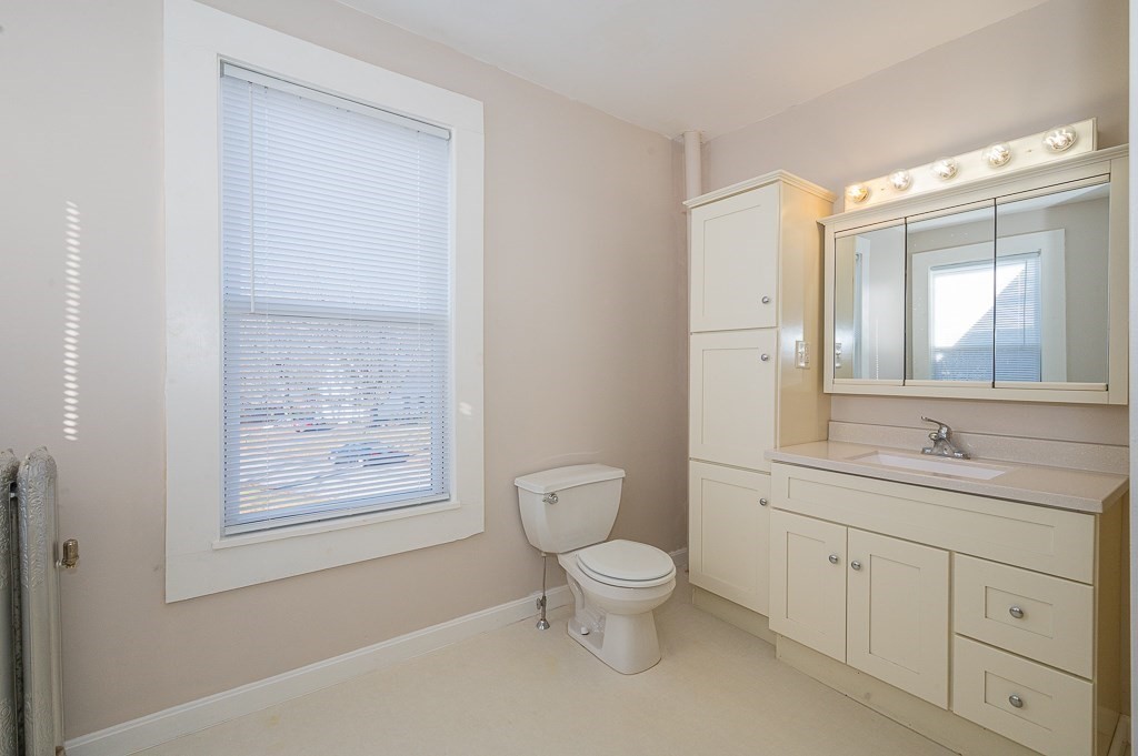 7 Ramsdell Street Warren, MA 01083 - Photo 17 of 34 a spacious bathroom with a toilet sink and mirror