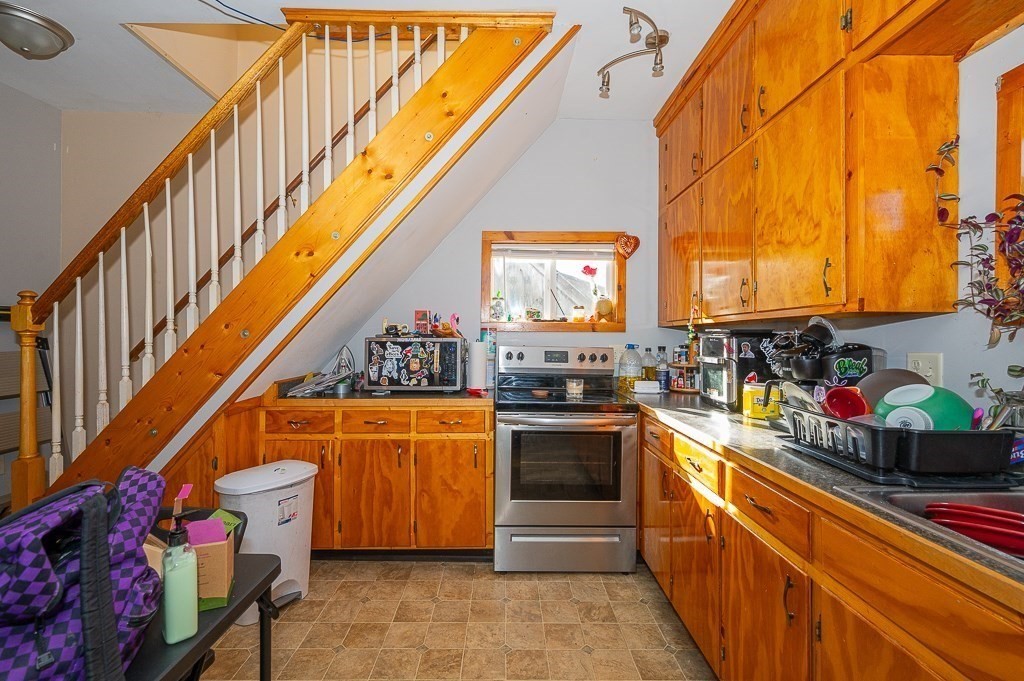 7 Ramsdell Street Warren, MA 01083 - Photo 21 of 34 a kitchen with stainless steel appliances granite countertop a stove a sink and a refrigerator
