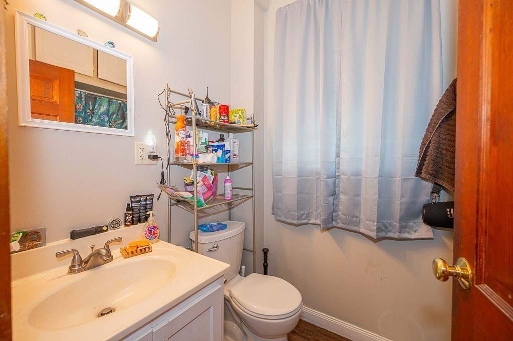 7 Ramsdell Street Warren, MA 01083 - Photo 25 of 34 a bathroom with a sink a toilet and a mirror