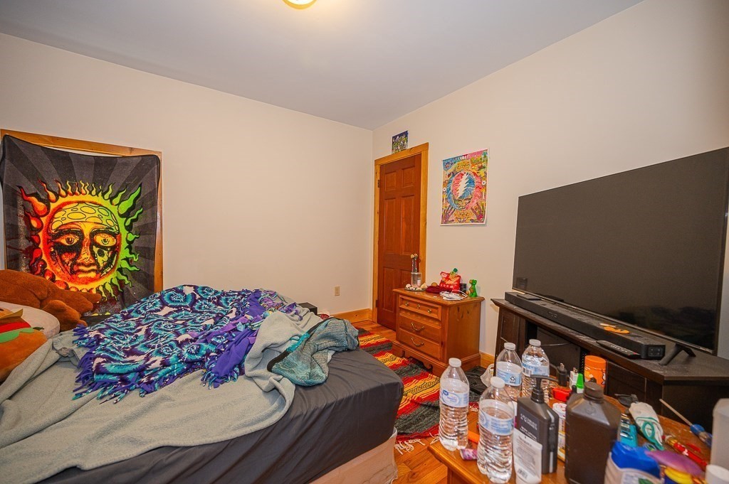 7 Ramsdell Street Warren, MA 01083 - Photo 30 of 34 a living room with blue wall paintings and a couch