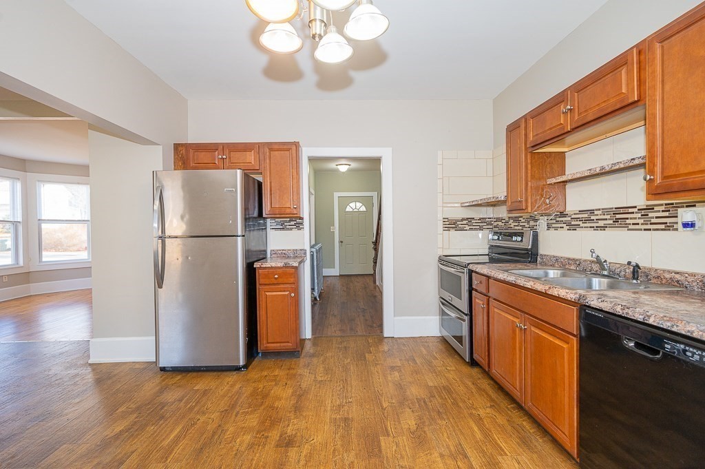 7 Ramsdell Street Warren, MA 01083 - Photo 4 of 34 a kitchen with stainless steel appliances granite countertop a refrigerator a stove and a wooden floors