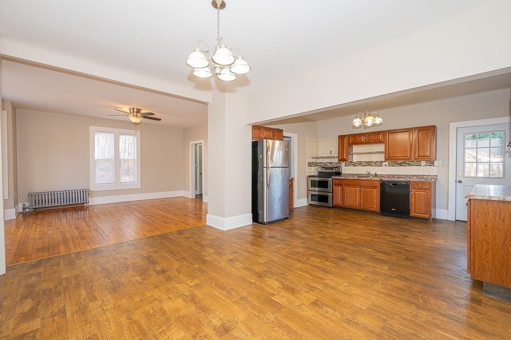 7 Ramsdell Street Warren, MA 01083 - Photo 6 of 34 a view of a kitchen with a stove cabinets and wooden floor