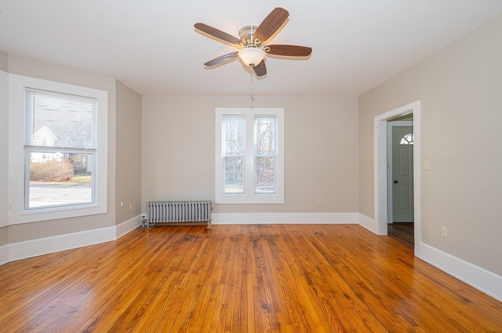 7 Ramsdell Street Warren, MA 01083 - Photo 7 of 34 a view of empty room with wooden floor and fan