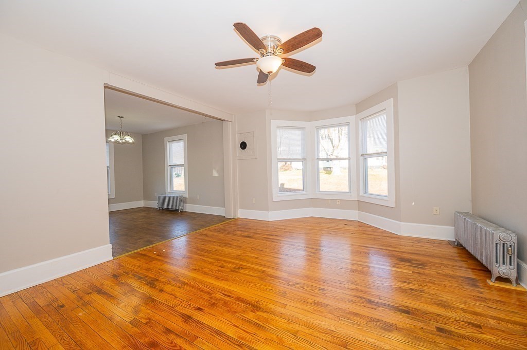 7 Ramsdell Street Warren, MA 01083 - Photo 8 of 34 a view of an empty room with window and wooden floor