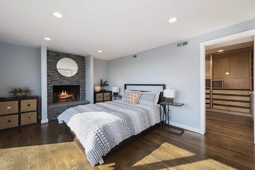 38 Rice Road Hingham, MA 02043 - Photo 24 of 41 a bedroom with a bed and a fireplace