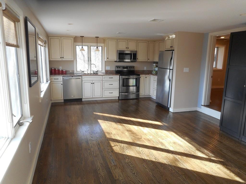 38 Rice Road Hingham, MA 02043 - Photo 31 of 41 a kitchen with stainless steel appliances granite countertop a refrigerator a stove top oven and a sink