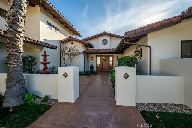 a view of a livingroom with wooden floor and furniture