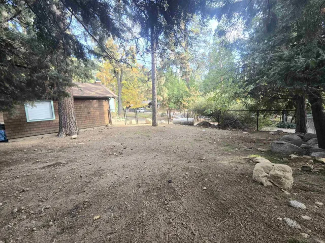 a view of a house with a tree