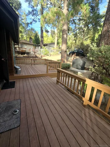 a view of a balcony with wooden floor