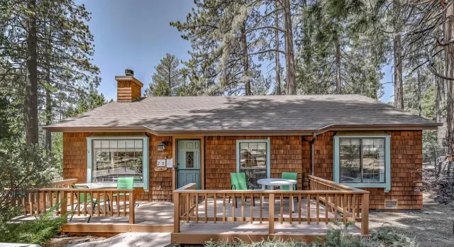 a view of a house with a porch and furniture