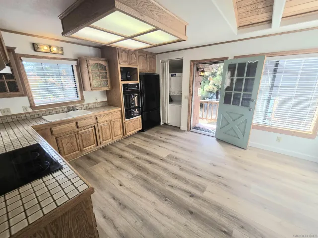 a large room with wooden floor and windows