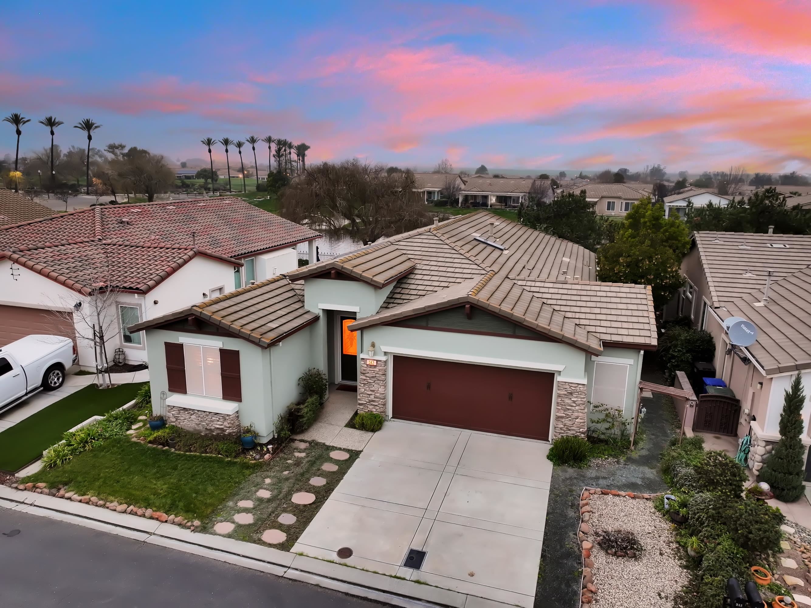 342 Desert Forest Court Rio Vista, CA 94571 - Photo 1 of 40 View of front of property with an attached garage, stucco siding, stone siding, driveway, and a tile roof