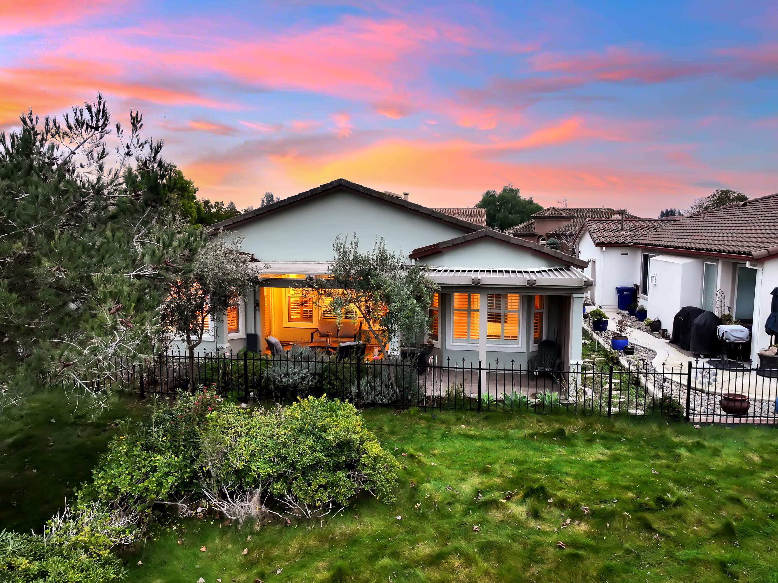 342 Desert Forest Court Rio Vista, CA 94571 - Photo 4 of 40 Rear view of house featuring a fenced front yard, stucco siding, and a patio area