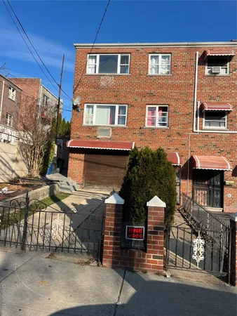 a view of a brick house with many windows