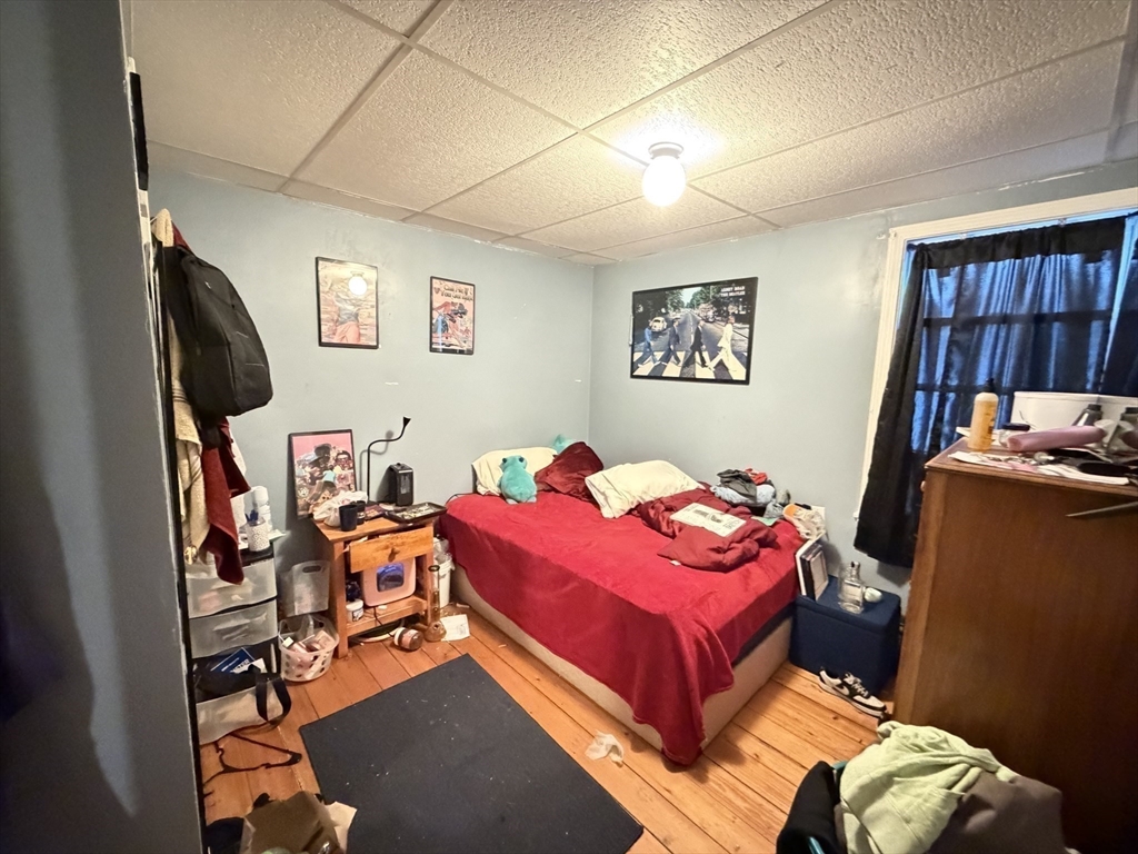 582 Cambridge Street Fall River, MA 02721 - Photo 13 of 19 a bedroom with bed and a flat screen tv