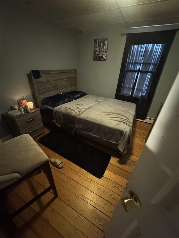 582 Cambridge Street Fall River, MA 02721 - Photo 16 of 19 a bed sitting in a bedroom next to a window