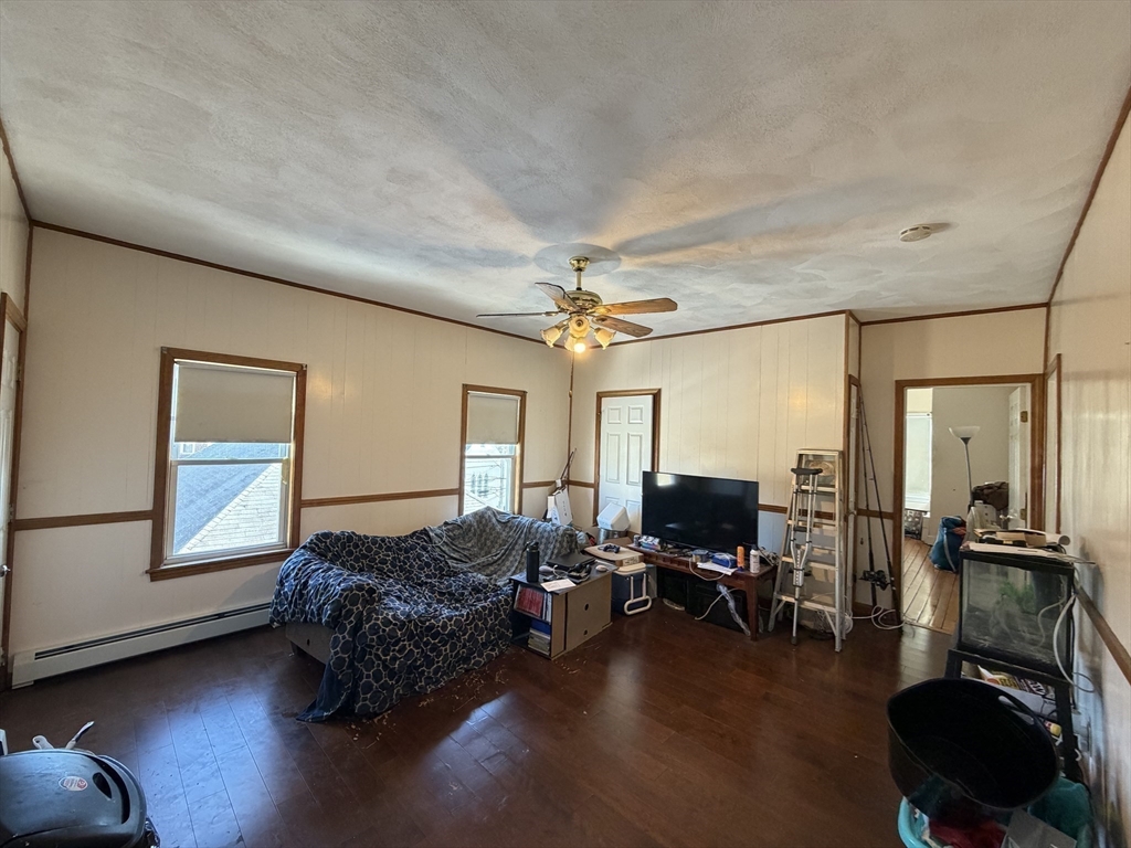 582 Cambridge Street Fall River, MA 02721 - Photo 7 of 19 a living room with furniture and a flat screen tv