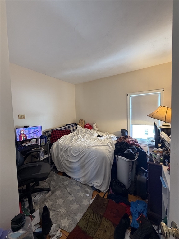 582 Cambridge Street Fall River, MA 02721 - Photo 8 of 19 a bedroom with a bed and a closet