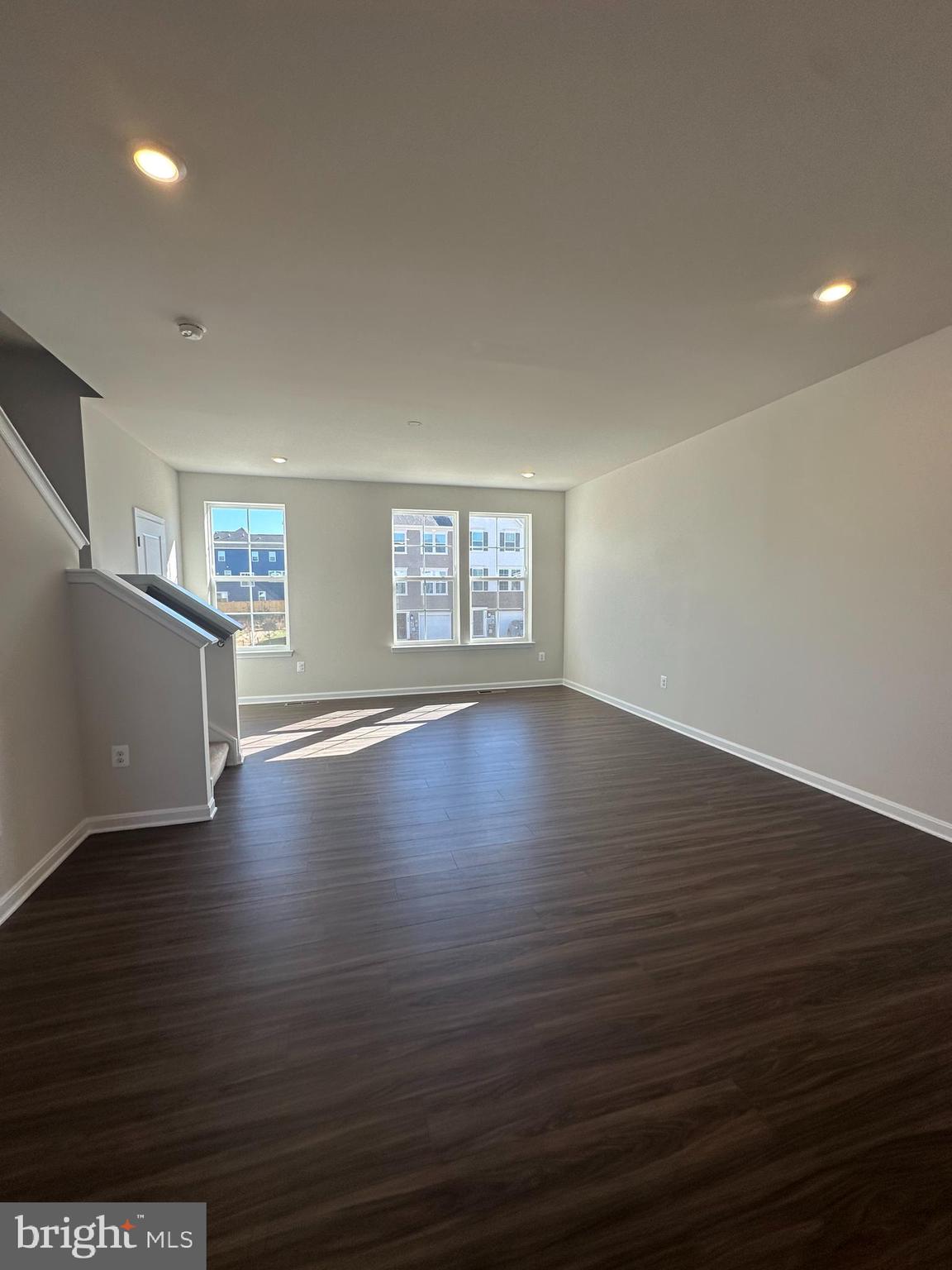 149 Telluride Way Charles Town, WV 25414 - Photo 14 of 39 a view of an empty room with wooden floor and a window