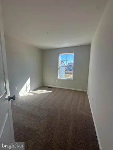 a view of empty room with windows