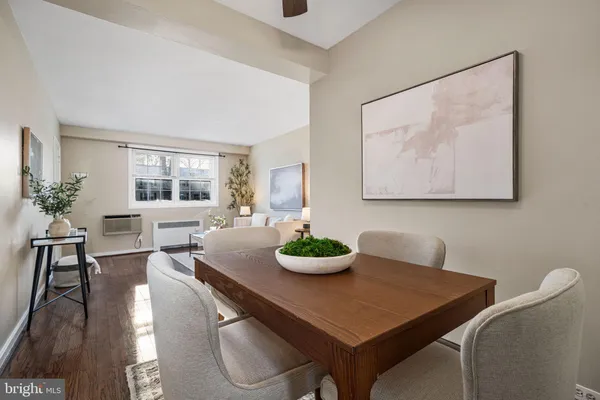 a dining room with furniture and window