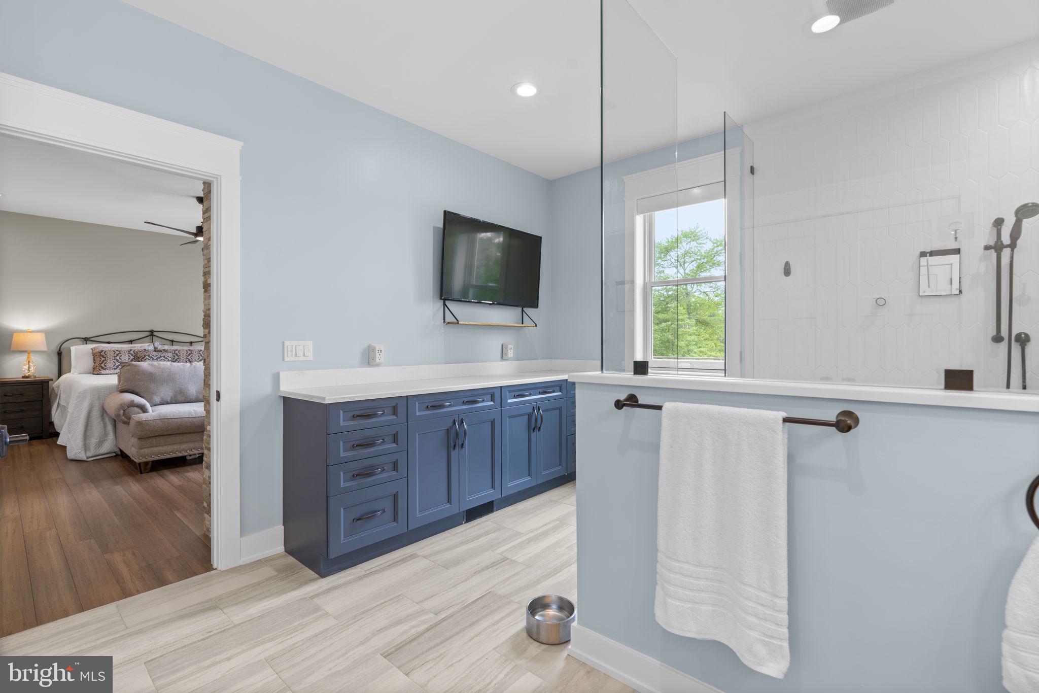 798 Creek View Road Severna Park, MD 21146 - Photo 27 of 72 a large bedroom with a bed and a flat screen television