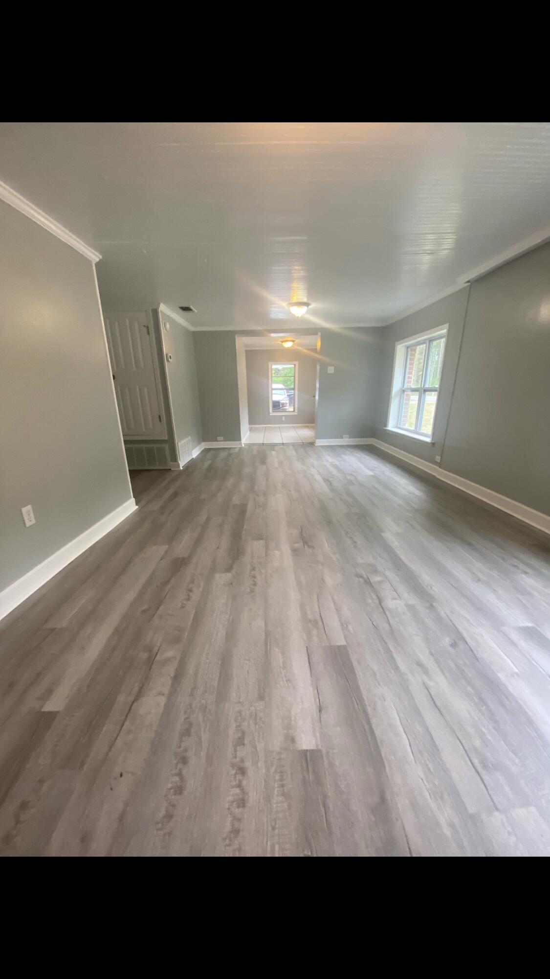 5333 Old River Road Baker, FL 32531 - Photo 4 of 12 a view of an empty room and wooden floor