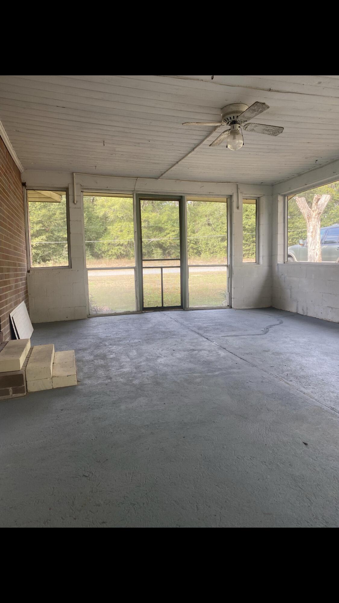 5333 Old River Road Baker, FL 32531 - Photo 8 of 12 a living room with furniture and a large window