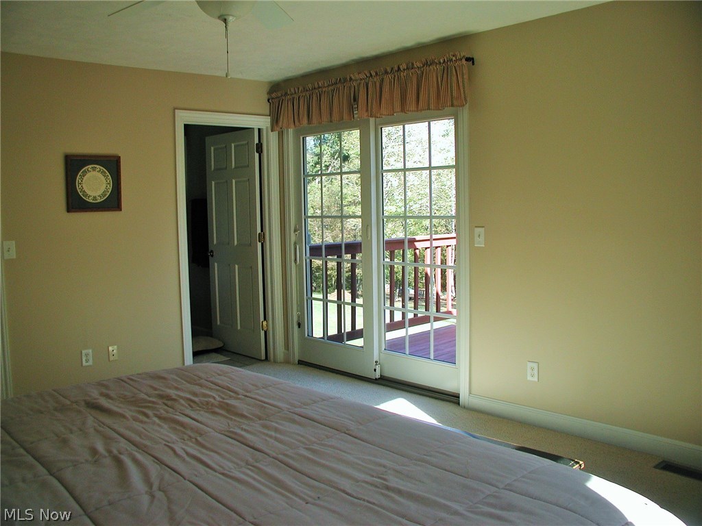 3020 Explorer Road Southwest Carrollton, OH 44615 - Photo 6 of 23 Master Bedroom boasts large walk-in closet, full bath plus your own private deck