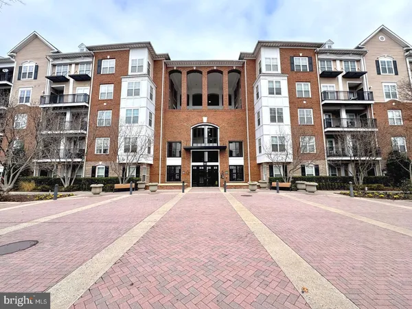 a front view of a building with street view