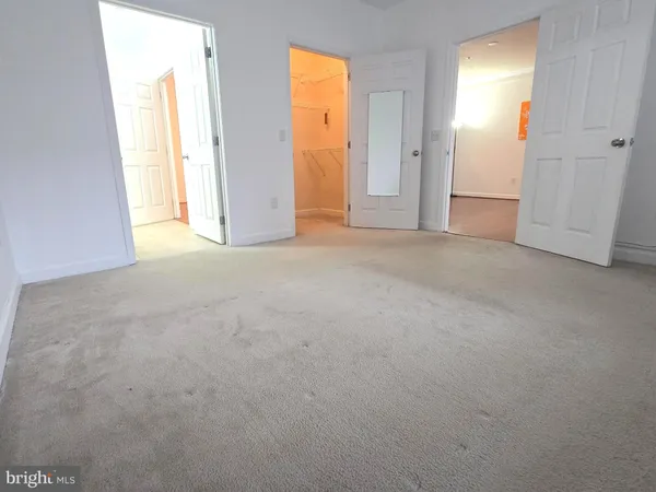 a view of empty room with windows