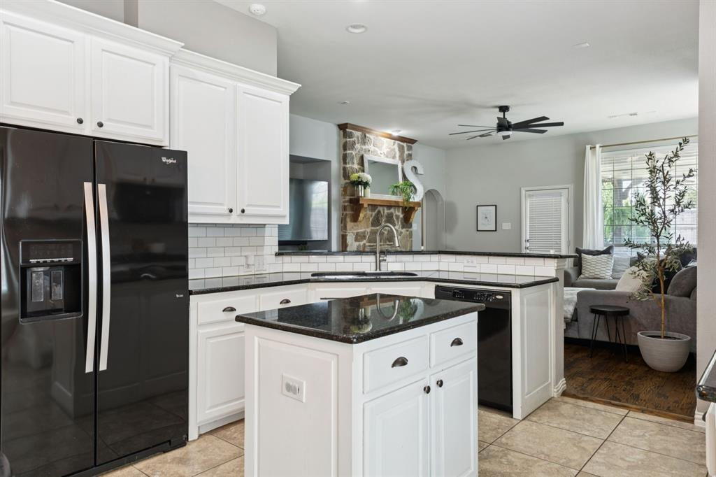910 Fox Ridge Trail Prosper, TX 75078 - Photo 5 of 25 a kitchen with stainless steel appliances granite countertop a sink stove and refrigerator