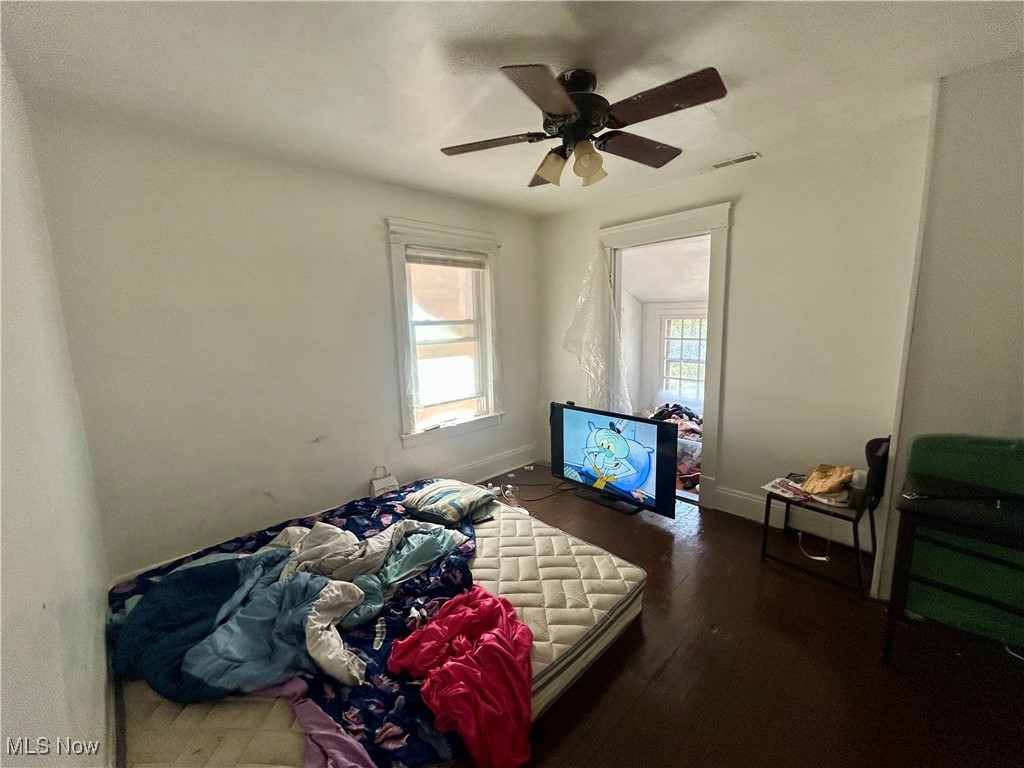 10202 Kinsman Road Cleveland, OH 44104 - Photo 12 of 15 Bedroom with dark wood finished floors and a ceiling fan