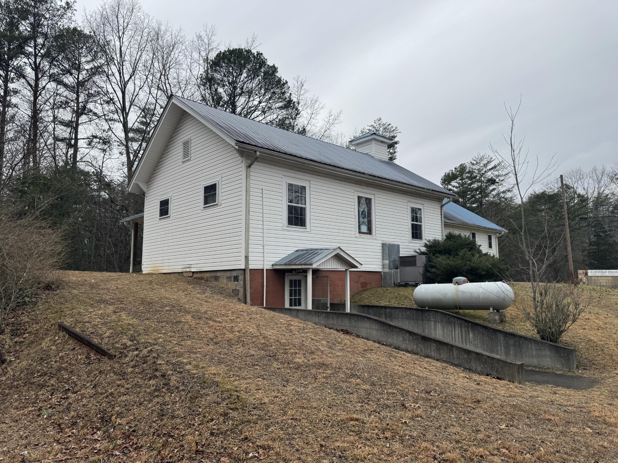 146 Croft Chapel Road Turtletown, TN 37391 - Photo 11 of 19 a view of a white house with a large bed and couches chairs
