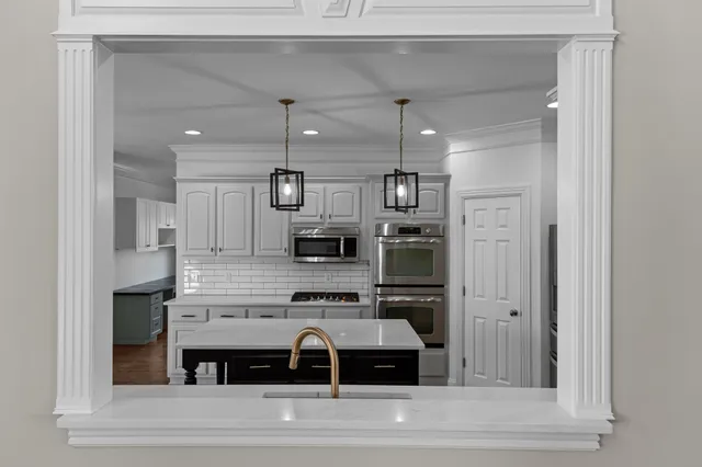 a view of cabinets and wooden floor